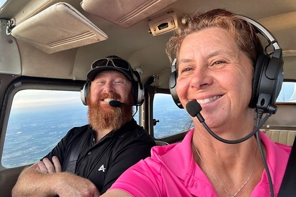 Smiling person experiencing their first flight
