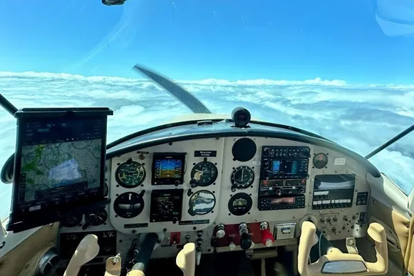 View from a cockpit above the clouds