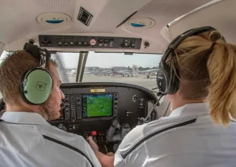Flight instructor teaching a student
