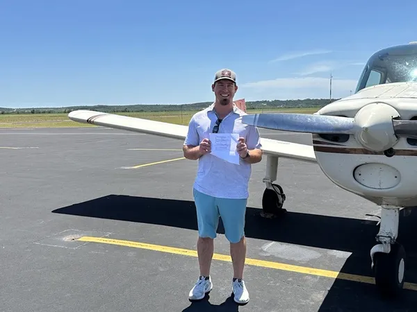 View over an airplane wing at sunset